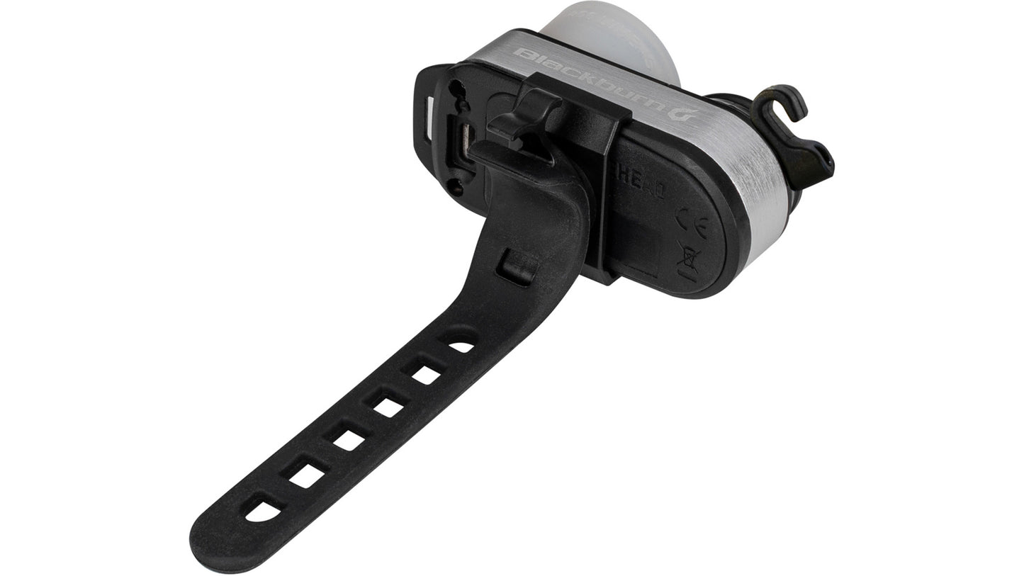 Achterkant van de Blackburn Outpost lamp die de clip en de siliconen strap-bevestiging toont.
